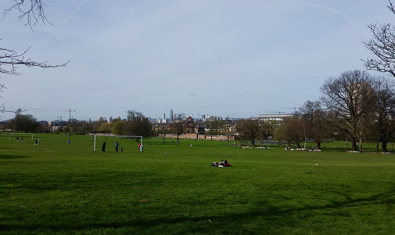 Open parkland and mature trees in Brockwell Park